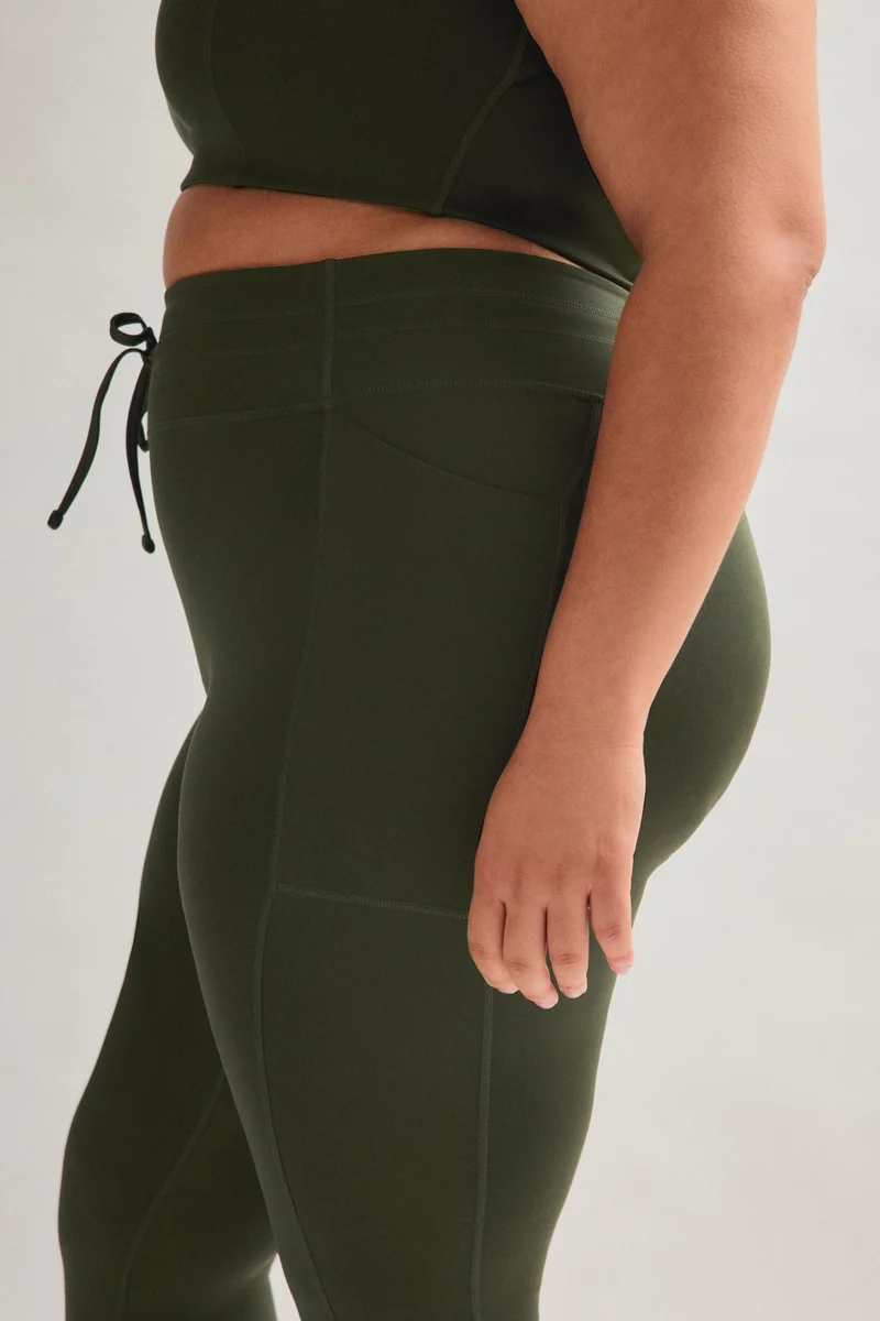 Legging de compression à cordon et poche plaquée