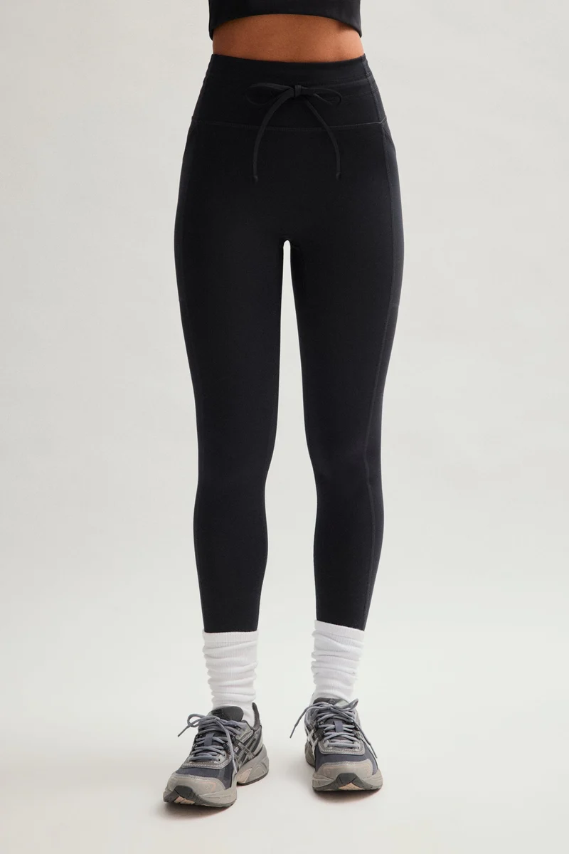 Legging noir compressif avec cordon de serrage et poches