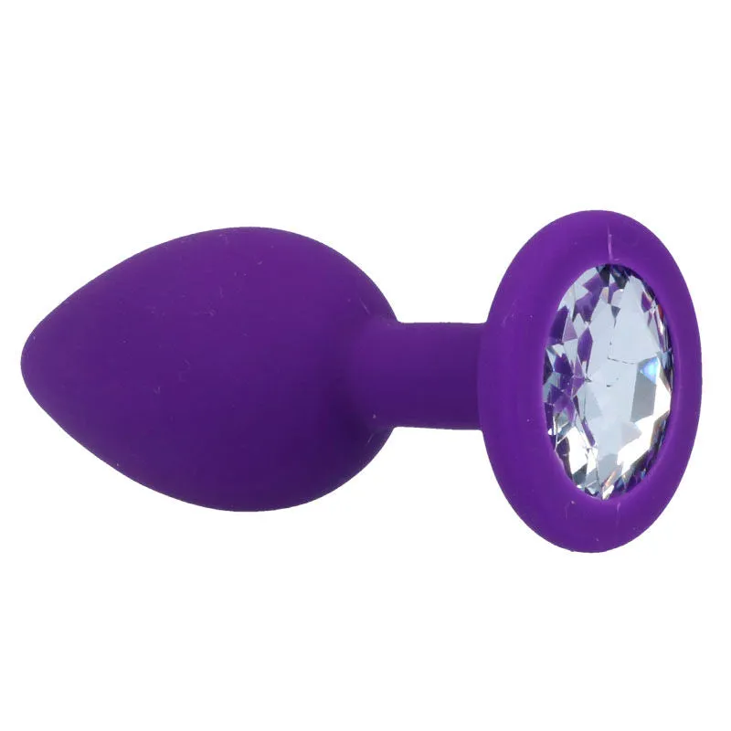 Plug anal silicone médical hypoallergénique doux soyeux ergonomique conique effilé insertion progressive base sécurisée faux diamant transparent lilas