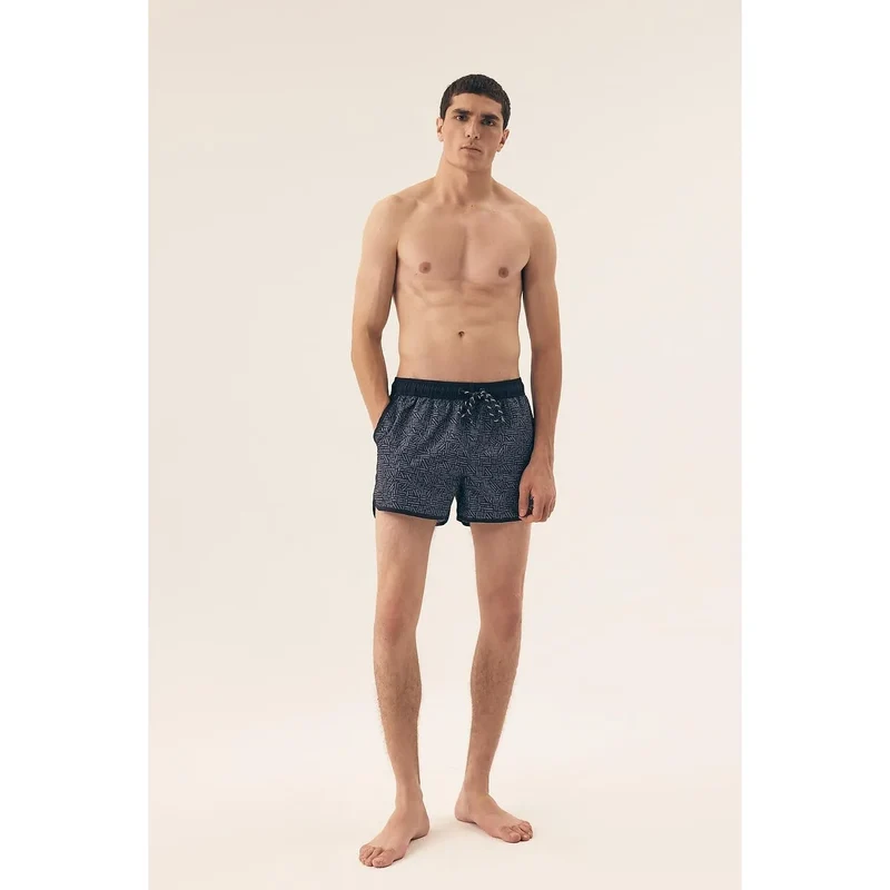 Short de bain homme moderne motif géométrique bleu et noir tissu synthétique séchage rapide plage sport occasionnels confortables fonctionnels